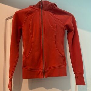 Lululemon Scuba Orange size 0, used no piling, no stains. Full zip.